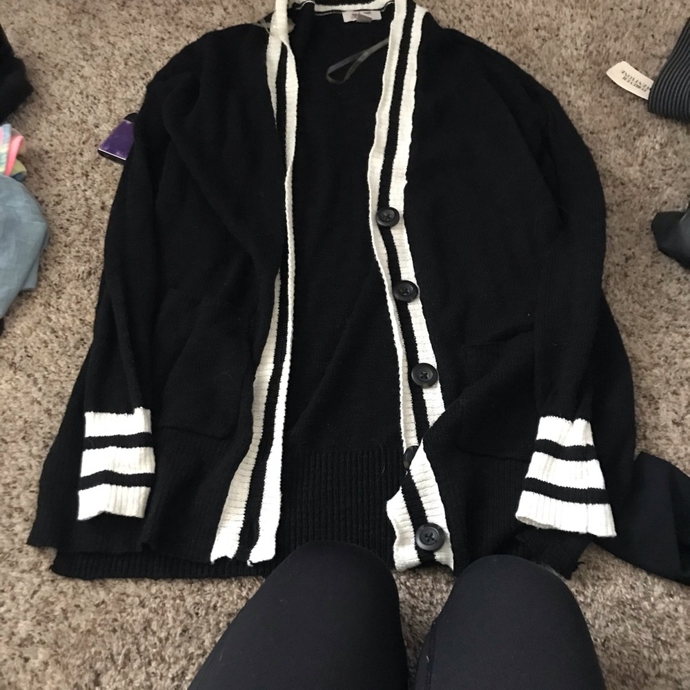 Black with white stopped cardigan very light weight not thick and has pockets